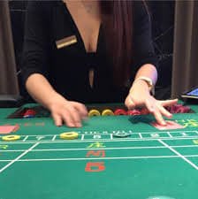 Filipino player aiming cannon at fish targets in 639jili fish game room
